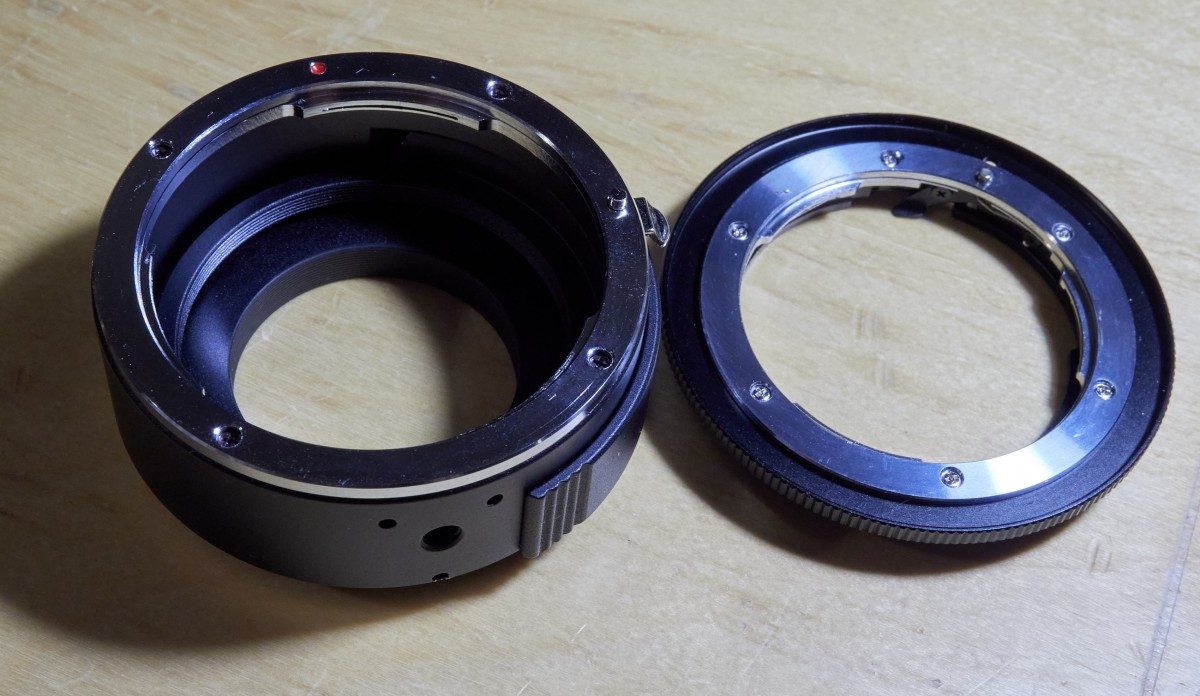 The DEO-TECH OWL EF/MFT adapter next to a K&F Concept OM/EF adapter.