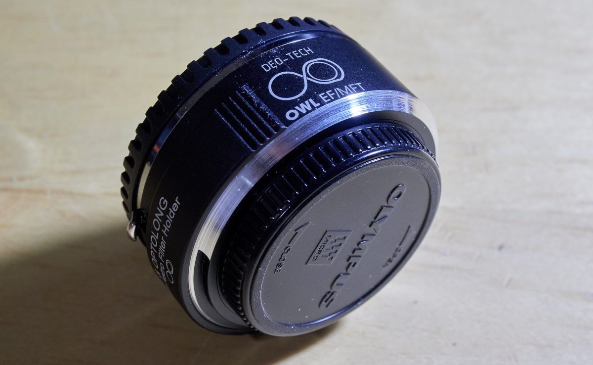 The DEO-TECH OWL EF/MFT adapter showing the modification done to allow it fit OM-D cameras. The bare aluminum area is where metal was cut away with a lathe.